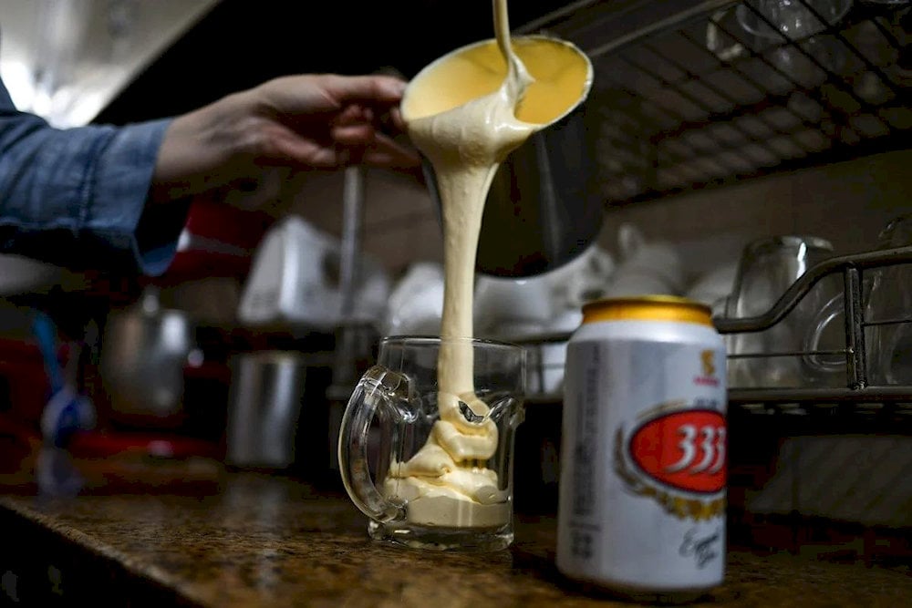 The velvety texture of whipped egg yolk perfectly balances the slight bitterness of the beer, creating a surprisingly smooth sip